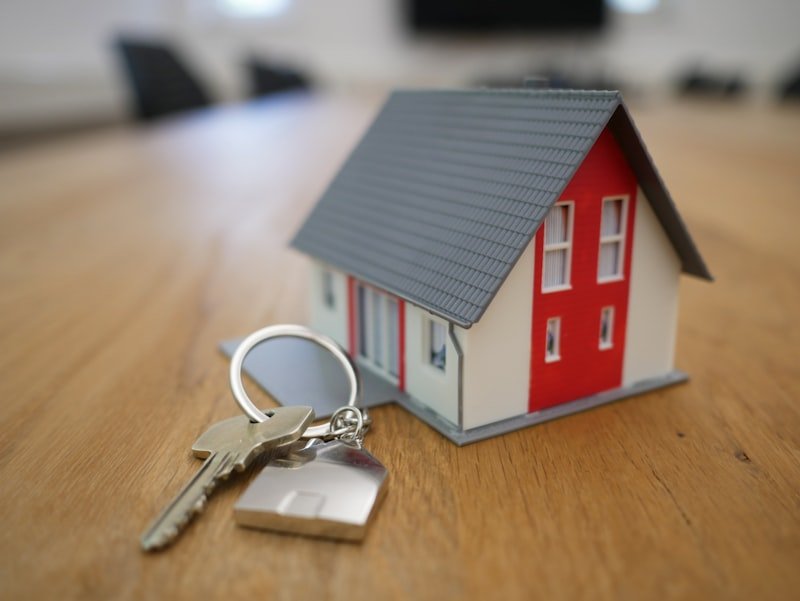 Keys to a new home in front of a front door